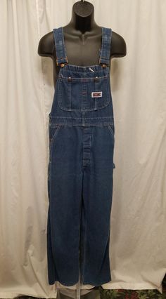 Vintage 1980s Big Mac Dark Wash Overalls Denim Bib Carpenter Dungarees, Workwear, Farm, Waist 36.  Excellent vintage condition - see pics! Overalls have a front 2 button closure, 2 deep side pockets, and 2 back pockets.  Shoulder straps are adjustable! Measurements: shoulder to shoulder 11 in, shoulder to bottom length 63, inseam 31, length from shoulder to crotch 33, top of bib 10 across, waist 36 inches. Dark Blue Overalls, Dungarees Outfit, Vintage Dungarees, Brown Overalls, Dungaree Outfit, Overalls 90s, Blue Jean Overalls, Overalls Denim, Vintage Overalls