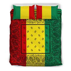 a bed with a red, yellow and green blanket on it's coverlet