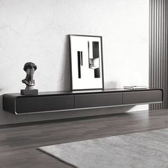 a black and white photo of a living room with a large mirror on the wall