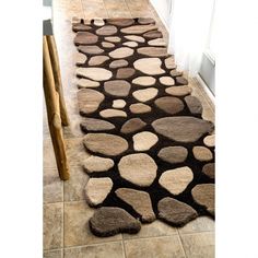 a brown and white area rug on the floor