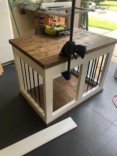 a workbench with an umbrella and tools on it