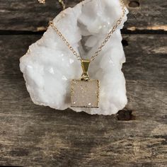 "Naturally beautiful jasper quartz druzy pendant hangs freely from a 14K gold filled cable chain. Druzy pendant is a gorgeous champagne color and sparkles brilliantly! It is framed in shiny gold plate, creating a beautiful contrast of tones and textures. - the back is left natural to allow light to pass through. Square shaped pendant measures approximately 5/8\" tall (not including top loop and bail) x 5/8\" wide. 14K gold filled cable chain is available in your desired length for the perfect cu Healing Gold Necklaces With Raw Stone, Gold Quartz Crystal Necklace As Gift, Gold Quartz Crystal Necklace For Gift, Gold Quartz Jewelry With Raw Stone, Gold Quartz Necklace With Spiritual Style, Gold Minimalist Charm Necklaces With Natural Stones, Minimalist Gold Charm Necklaces With Natural Stones, Minimalist Gold Charm Necklace With Natural Stones, Gold Crystal Necklace With Raw Stone For Gifts