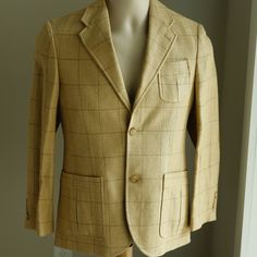 This Ralph Lauren Designer Boy's Windowpane Tweed Sport Coat/Blazer Is Pure Luxury! Your Boy Will Look Debonair In This One! The Coat Is Made Of A Fine Linen/Silk Blend And Is Done In A Windowpane Tweed In Shades Of Tan And Brown. It Has A Notched Lapel, Single Breasted 3-Button Closure (Top Button Not Buttoned In Main Image), 2 Functional Pockets With Pocket Pleats, A Chest Pocket With The Same Detailed Pocket Pleat, 2 Interior Pockets, A Back Vent. This Coat Also Sports Bi-Swing Gussets (Not Only For Style, But Easy Movement)And A Belted Back. The Style On This One Is Incredible! The Elbows Have Suede Patches And The Cuffs Have 4 Buttons. It Is Fully Lined And Has A Preppy Striped Lining I Fitted Tweed Jacket With Patch Pockets For Spring, Brown Spring Sport Coat With Welt Pockets, Classic Spring Tweed Jacket With Patch Pockets, Spring Brown Sport Coat With Welt Pockets, Brown Sport Coat With Welt Pockets For Spring, Classic Beige Tweed Jacket With Pockets, Spring Wool Suits With Pockets, Fitted Spring Sport Coat With Patch Pockets, Casual Fitted Beige Suit