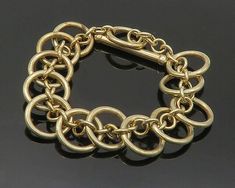 "925 Sterling Silver - Vintage Gold Plated Circle Link Chain Bracelet - BT8326  925 Sterling Silver - Vintage Gold Plated Circle Link Chain Bracelet - BT8326  Jewelry Type:         Bracelet  Metal Type:            925 Silver  Metal Size:             8.5\" Length  .75\" Height   Stone Type:            N/A  Condition:              N/A  Jewelry Weight:     24.7 Grams  PLEASE NOTE: THIS ITEM IS PRE-OWNED. ALTHOUGH MOST ITEMS ARE IN VERY GOOD CONDITION, SOME MAY NEED CLEANING AND/OR MINOR REPAIRS. WE MAKE A VERY STRONG EFFORT TO UPLOAD CLEAR PICTURES. PLEASE INSPECT ALL PICTURES AND ASK ALL QUESTIONS YOU MAY HAVE PRIOR TO MAKING A PURCHASE. NOT ALL STONES ARE GENUINE, SOME ARE ENHANCED OR CREATED." Elegant Chain Link Bracelets With Jump Ring, Elegant Link Bracelets With Jump Ring, Clear Pictures, Bracelet Metal, Link Chain Bracelet, Metal Bracelets, Link Chain, Chain Bracelet, Vintage Gold