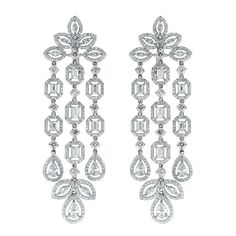 The Beauvince Legacy diamond earrings feature a important and emphatic design befitting a queen. The over-sized chandelier earrings are stated, royal & elegant. Diamonds Shapes: Pear Shape, Marquise, Emerald & Round Total Diamonds Weight: 8.55 ct Diamonds Color: G - H Diamonds Clarity: VS (Very Slightly Included) Metal: 18K White Gold Metal Wt: 30.31 gms Setting: Prong Set Length: 3 Inches Price Quoted may be negotiable. Please contact us to view and discuss. Fine Pearl Jewelry, Diamond Chandelier Earrings, Diamond Chandelier, Gold Chandelier Earrings, Diamond Free, Diamond Drops, Pear Shaped Diamond, Lovely Jewellery, Diamond Clarity