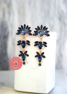 Blue Navy Earrings, Bridal Blue Navy LONG Earrings, Dark Blue Chandelier Earrings, Blue Navy Crystal Swarovski Earrings, Navy Blue Wedding Add a sophisticated stylish glow to any outfit with these beautiful lightweight Swarovski crystal chandeliers.Details : ♥ U.S packages shipped via USPS® insured+USPS® tracking number♥ 1-year guarantee♥ Materials- 14k Gold  or Silver Plated over brass CRYSTALLIZED™ Swarovski Element♥ Posts on top ♥ Size approx (72mm h  x 31mm w), (2.8" h x 1.2" w)♥ Color White Blue Chandelier Earrings For Evening With Pierced Ears, Blue Chandelier Earrings For Evening, Elegant Blue Long Drop Chandelier Earrings, Blue Chandelier Drop Earrings For Evening, Blue Long Drop Jewelry For Wedding, Blue Long Drop Earrings For Wedding, Blue Long Drop Wedding Jewelry, Blue Drop Earrings For Evening Bridal, Blue Drop Bridal Earrings For Evening