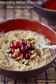 a bowl filled with oatmeal topped with cherries