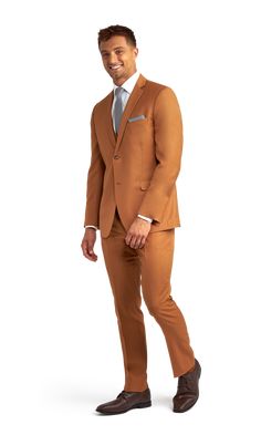 A slim caramel suit with two buttons and a notch lapel. Brown Three-piece Suit With Notch Lapel For Business, Brown Three-piece Notch Lapel Suit For Business, Fitted Brown Blazer With Welt Pockets, Tailored Brown Three-piece Suit With Notch Lapel, Brown Flat Front Suits For Formal Occasions, Brown Double Breasted Suit With Notch Lapel, Formal Brown Suit With Single Button, Brown Tailored Three-piece Suit For Business Casual, Tailored Brown Three-piece Suit For Business Casual