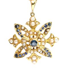 A stunning Edwardian 15ct gold Sapphire and Pearl pendant in excellent condition  Stamped 15C this has been professionally cleaned but left unpolished so as not to remove the antique patina  In Britain, or England and the British Isles, the use of 15k (usually marked 15ct) was utilized for a number of years.   From the year 1854 to 1931, you may find gold jewelry testing at or hallmarked with either 15ct or 625.  The pendant measures 28mm in diameter with a 6mm bale and weighs 6gms Free internat Antique White Gold Pearl Pendant Jewelry, Antique White Gold Jewelry With Pearl Pendant, Ornate 14k Stamped Ceremonial Jewelry, Ornate 14k Stamped Jewelry For Ceremonial Occasions, Antique Hallmarked Yellow Gold Jewelry, Victorian Gold Jewelry With Pearl Pendant, Ornate Yellow Gold Pendant Jewelry, Ornate Hallmarked Yellow Gold Jewelry, Ceremonial 14k Stamped Pendant Jewelry