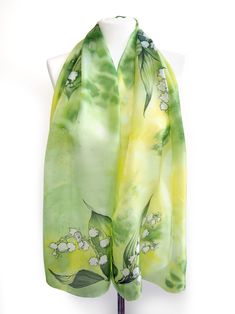 Lily of the Valley silk scarf was hand painted on lightweight Habotai. Size is 61 inches in lenght and 17 inches in width. (155 by 43 centimeters) Silk is called Habotai Light, a Chinese pure silk of delicate gloss, delicacy and charm. This foulard is painted with silk paints in bright yellowish green color set with a detailed and realistic picture of Lily of the valley flowers on both ends and in the middle. Please allow for small differences in color set and design due to the nature of hand ma Green Scarf As Spring Gift, Green Scarves For Spring Gift, Green Scarf For Spring Gift, Artistic Green Silk Scarf With Floral Print, Green Floral Print Scarf For Gift, Green Floral Print Scarves As Gift, Lily Valley, Valley Cottage, Green Silk Scarf