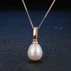 A luminous white pearl with a ridged sterling silver cap setting (gold setting available) is suspended from a smooth box chain. At 17 inches in length, this pearl pendant offers a modern and elegant look. It is also a perfect choice for a wedding bridal pendant. Pendant Necklaces For Women | Freshwater Pearl Drop Pendant Finish off any outfit with a gorgeous handmade Freshwater pearl necklace from Huge Tomato. With a wide online collection of striking vintage-inspired necklace designs, lovingly Single Pearl Pendant, Pearl Drop Pendant, Bridal Pendant, Pearl Bridal Jewelry, Pearl Jewelry Wedding, White Pearl Necklace, Rose Gold Pendant, White Freshwater Pearl, Sterling Silver Necklace Pendants