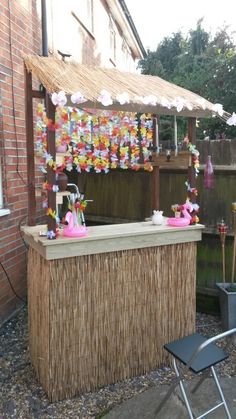 an outdoor bar with decorations on the outside