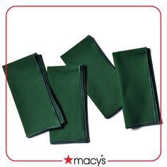 four green napkins sitting on top of each other