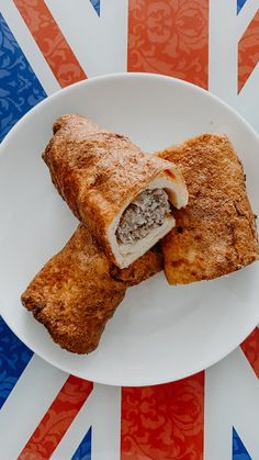 two pieces of food on a plate with the british flag in the background