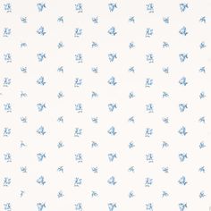 a blue and white wallpaper with small flowers on it's side, in the middle