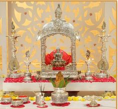 the altar is decorated with silver and red flowers