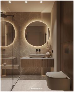 a modern bathroom with two round mirrors above the sink and toilet, along with a walk in shower