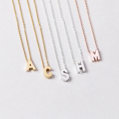 Uppercase initial necklace - perfect for a meaningful gift to someone special or yourself. D E T A I L S * Single initial size is approximately 6 x 7 mm * Chain is 14k gold fill, sterling silver, or 14k rose gold fill OR 14k gold plate, silver plate, or 14k rose gold plate * Charms are matte gold plate, matte silver plate, or shiny rose gold plate * This listing is for one necklace P R O M O T I O N * Bridesmaids gifts: message us for a coupon code * New FACEBOOK or INSTAGRAM followers: follow u Dainty Letter Initial Necklace For Mother's Day, Dainty Custom Name Initial Necklace, Dainty Personalized Initial Necklace, Dainty Personalized Tan Necklaces, Dainty Personalized Tan Necklace, Mother's Day Initial Necklace With Letter Beads, Mother's Day Initial Pendant Necklace With Letter Beads, Dainty Initials Letter Charm Necklace, Dainty Letter Charm Necklace With Initials