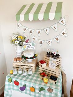 a green and white checkered table cloth with food on it next to a sign that says yogurt grow