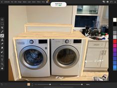 an image of two washing machines in a room with color swatches on the wall