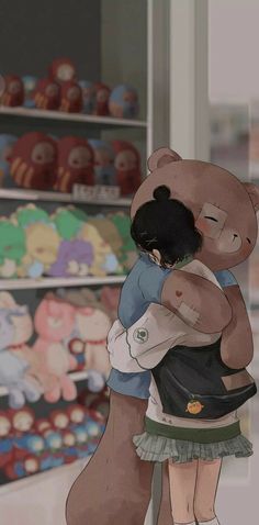 a girl hugging a large teddy bear in a store