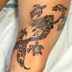 a woman's leg with a tattoo design on it