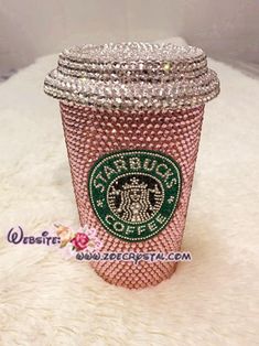 a pink starbucks cup covered in lots of swarong