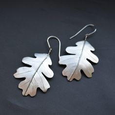 Surgical steel earrings. The individual parts are laser cut according to their own design, shaped and then joined into a finished form Silver Laser Cut Earrings As Gift, Tin Jewelry, Surgical Steel Earrings, Steel Earrings, Oak Leaf, Stainless Steel Earrings, Rose Buds, Chandelier Earrings, Jewelry Ideas