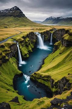 an aerial view of a waterfall in iceland