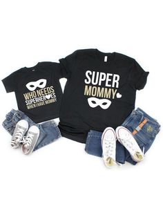 Twin with your mini superhero in our adorable mommy and me black t-shirt set! 100% cotton tops short sleeve style black t-shirts with a white and light gold design women's fit kids unisex t-shirts perfect as a Mother's Day gift Super Mom T Shirt, Unisex Black T-shirt For Family, Family Matching Black Tops With Character Print, Black Family Matching Tops With Character Print, Black Unisex T-shirt For Family Occasions, Mother's Day Black T-shirt With Funny Print, Superhero Black Top With Letter Print, Black Superhero Top With Letter Print, Superhero Style Black Top With Letter Print