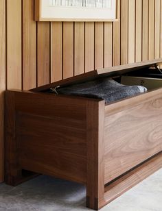 an open drawer in a wood paneled room