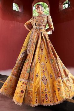 Mustard yellow jamawar attached cancan panelled lehenga in floral geometric pattern with resham, zari and pearl hand embroidery. Paired with a matching padded blouse embellished with resham, pearl and zari embroidery, dupatta in shimmer tissue base with zari border and embellished belt. - Aza Fashions Yellow Raw Silk Dress For Reception, Yellow Raw Silk Sets For Wedding, Yellow Raw Silk Wedding Sets, Yellow Raw Silk Dress With Intricate Embroidery, Yellow Cutdana Dress For Transitional Season, Yellow Embroidered Raw Silk Dress, Yellow Wedding Sets For Transitional Season, Transitional Yellow Anarkali Lehenga, Yellow Traditional Wear With Cutdana For Reception