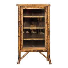 an old bamboo cabinet with glass doors