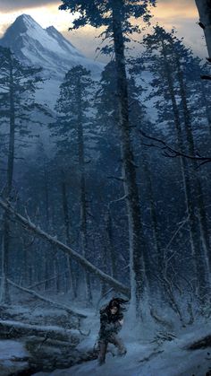 a person walking through the snow in front of a snowy mountain with trees on it