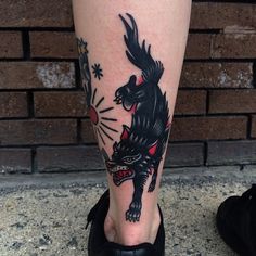 a person with a tattoo on their leg that has a dragon and firework in it