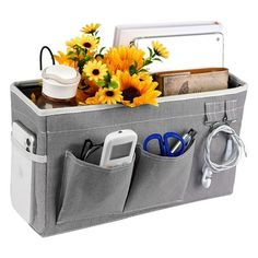 a large gray storage bag with sunflowers and other items in it's pockets