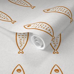 a white wallpaper with orange fish on it