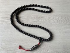 Handmade Nepali Dark brown Bodhi seed mala with Natural DZI Stone Beads From Nepal. 11mm with 108 beads Necklace Spiritual Black Beads Mala For Meditation, Traditional Hand-strung Black Mala, Traditional Black Hand-strung Mala, Traditional Black Mala With 8mm Beads, Traditional Black Mala With 108 Beads, Handmade Amulet Mala For Meditation, Hand-strung Amulet Mala For Meditation, Handmade Mala Amulet For Rituals, Handmade Amulet Mala For Rituals