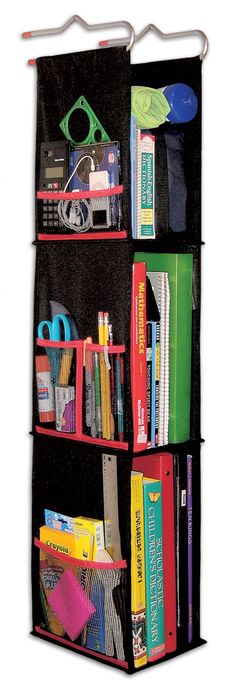 the hanging bookcase is filled with books and school supplies