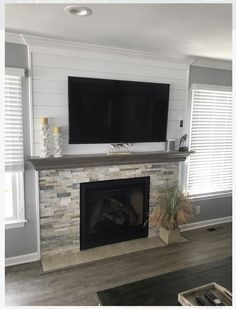 a fireplace with a flat screen tv above it