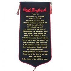 a banner with the words good shepherd written in red and black on it's side