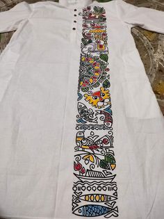 a white shirt with colorful designs on it