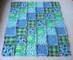 a blue and green patchwork rug on the floor