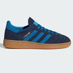 Brand new NWT Adidas Handball Spezial W Sneakers in Night Indigo Bright Blue Navy Gum Sole Size Women’s 7.5 💙🩵. Sold out on Adidas site. Gorgeous colorway! Never worn & box with extra navy blue laces shown in photos included. *These are made in Women’s sizes, please read sizing reviews. Will ship same day if ordered before 12PM EST M-Sat excluding holidays.* SHOES BORN IN THE '70S AND MADE FOR MODERN LIFE. Go where your spirit moves you in these adidas sneakers. First released in 1979 for pro indoor courts and since adopted as street style icons, the low-profile Handball Spezial shoes channel an always-on retro vibe. The design is now reimagined for free spirits who set their own course. Premium suede shapes the upper, accented by suede 3-Stripes and other signature details inspired by a Blue Athleisure Sneakers With Adidas Branding, Blue Athleisure Sneakers With Three Stripes Branding, Blue Adidas Sportswear Sneakers, Adidas Nmd R1 White, Shoes Born, Adidas Nizza Platform, Spezial Shoes, Rose Gold Adidas, Nmd Sneakers