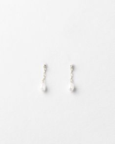 In the forecast: a soft shower of pearls.Make your earscape dance with tiny freshwater pearls dropped from the daintiest chain—a whisper, not a shout. Ideal for your wedding day, every day or a pearls’ night out. Sold as a pair.Pair with the rest of the dream team: our Pearl Droplet Necklace, Bracelet and Anklet. As with any pearl piece, we recommend keeping away from harsh cleansers and beauty products, wearing them often, storing them in linen or cloth (no airtight containers) and gently wipin Minimalist Pearl Drop Earrings For Party, Dainty Pearl Chain Earrings For Party, Dainty Pearl Charm Earrings For Parties, Minimalist Pearl Chain Earrings For Party, Minimalist Pearl Earrings With Pearl Charm For Parties, Minimalist Pearl Charm Earrings For Party, Dainty Drop Earrings With Pearl Chain, Delicate Sterling Silver Pearl Drop Bridal Earrings, Delicate Sterling Silver Bridal Earrings With Pearl Drop