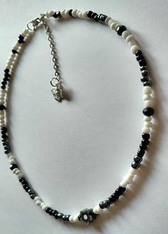 Black, White & Dark Greyish metallic Beaded, Flower Necklace>> 17 Inches Long + [With Extension Chain] = 18.5 Inches Long. Black Beaded Necklace Aesthetic, Trendy White Faceted Bead Necklaces, Trendy White Necklaces With Faceted Beads, Trendy White Necklace With Faceted Beads, White Beaded Necklaces With Black Beads As Gift, White Beaded Necklaces With Black Beads For Gifts, White Jewelry With Black Beads As Gift, Trendy Black Beads For Gifts, White Faceted Beaded Necklaces For Gifts