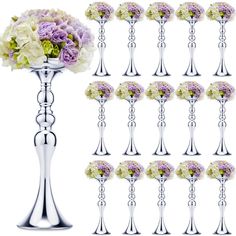 a bunch of vases with flowers in them on a white background, all lined up and ready to be placed