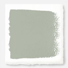 a light green paint swatch on a white background