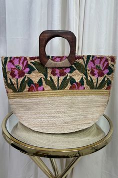 Featuring a Ladies Jute Flower Print Handbag, this high-quality accessory boasts a sturdy Square Wooden handle and showcases the beauty of natural materials. Perfect for a casual, yet stylish look during spring and summer, this handbag measures 11 W x 19 L x 12 H(inch) and weighs only 1 lb. Made in India Jute Flowers, Flower Handbag, Printed Handbags, Swimwear Sale, Only 1, Wooden Handles, Flower Print, Flower Prints, Natural Materials