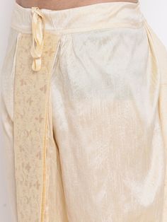 VM By VASTRAMAY Men's Gold Embroidered Dhoti Pant The VM By VASTRAMAY Men's Gold Embroidered Dhoti Pant is a perfect blend of traditional aesthetics and modern comfort. Designed with intricate embroidery, this dhoti pant is ideal for festive occasions, weddings, and cultural events. The luxurious gold hue adds a regal touch to your attire, making you stand out in any crowd. Key Features Elegant gold color with intricate embroidery Comfortable fit for all-day wear Perfect for festive and cultural Embellishment Embroidery, Dhoti Pants, Cultural Events, Intricate Embroidery, Mens Gold, Free Size, Gold Color, Khaki Pants, Comfort Fit